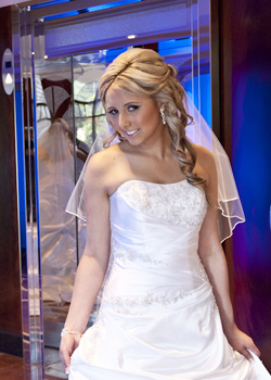 soft, full rolled hair style and romantic wedding makeup for bride